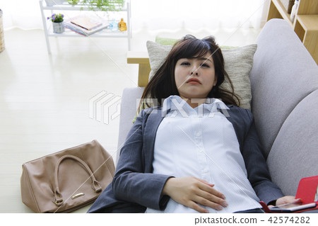 Tired young lady sick young lady business woman tired tired physical self management 42574282