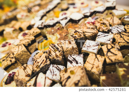 Delicious sweets on wedding candy buffet with desserts, cupcakes 42575281