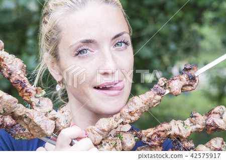 Woman sticking out her tongue with pleasure Woman sticking out her tongue with pleasure 42575917