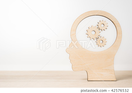 wooden man silhouette head with gearwheel wooden man silhouette head with gearwheel 42576532