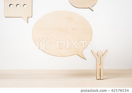 wooden businessman icon with dialogue frame wooden businessman icon with dialogue frame 42576534
