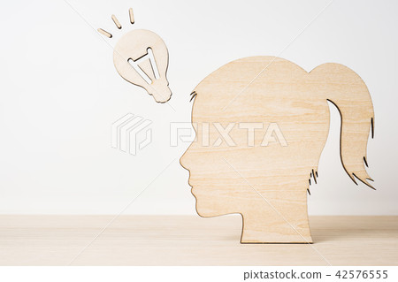 wooden girl silhouette head with idea lightbulb wooden girl silhouette head with idea lightbulb 42576555