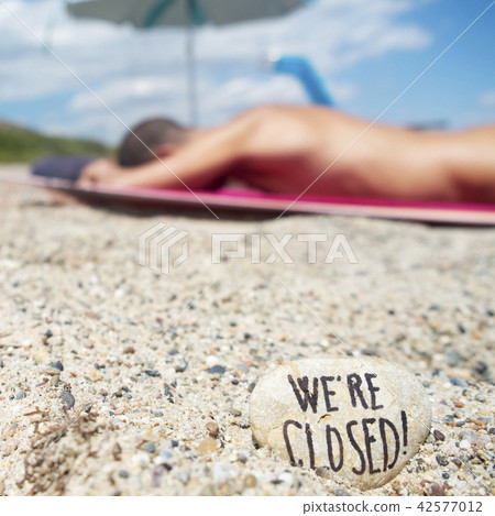 man on the beach and text we are closed man on the beach and text we are closed 42577012