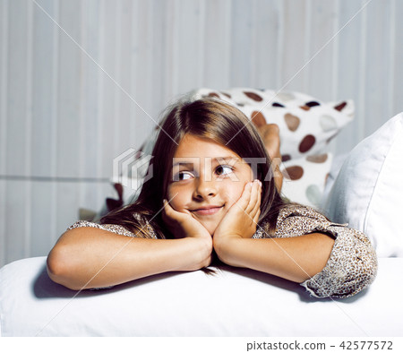 little cute brunette girl at home interior happy smiling close u 42577572