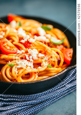 Italian pasta with tomato sauce in pan Italian pasta with tomato sauce in pan 42578598