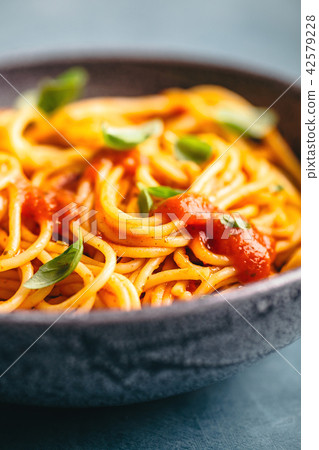 Italian pasta with tomato sauce in bowl 42579228