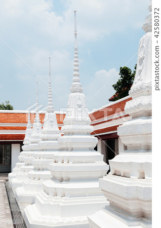 White stupa pagodas of Wat Ratchaorotsaram Bangkok 42580372