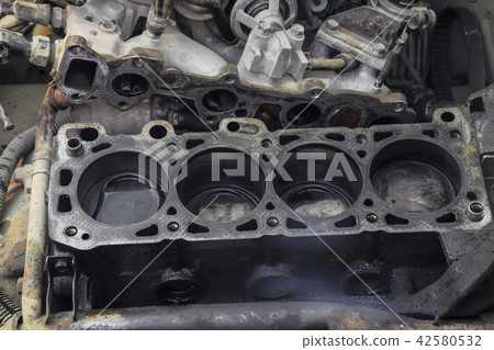 The cylinder block of the four-cylinder engine. Disassembled motor vehicle for repair. Parts in 42580532