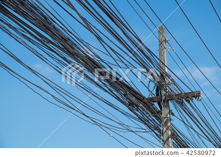 Electric wire on the power poles. 42580972
