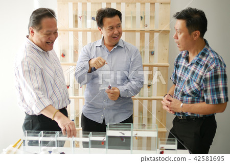 Business owner is selling siamese fighting fish Business owner is selling siamese fighting fish 42581695
