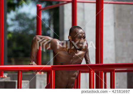 Athlete doing exercises at stadium Athlete doing exercises at stadium 42581697