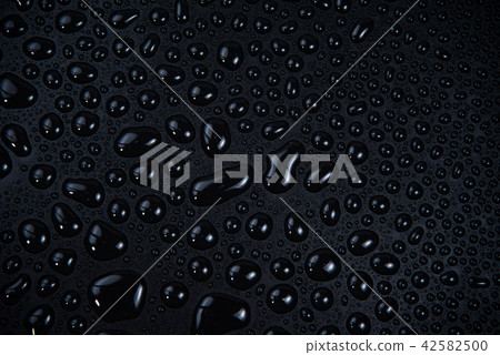 Drops of water on black background. 42582500
