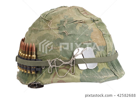 US Army helmet with camouflage cover and ammo belt 42582688