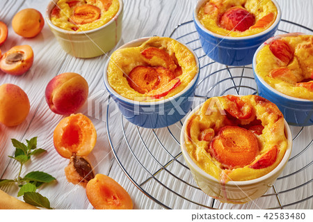 french summer dessert - Baked apricot clafoutis 42583480