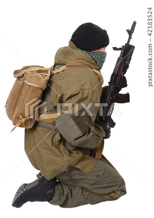 fighter with ak-47 rifle 42583524