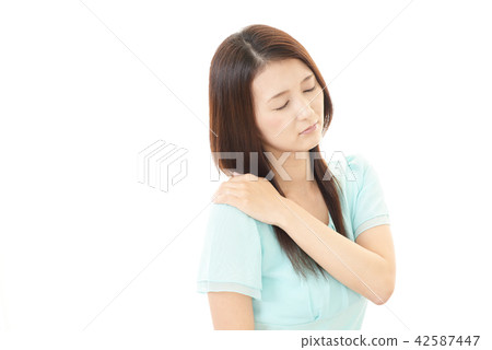 Women complaining of stiff shoulders 42587447
