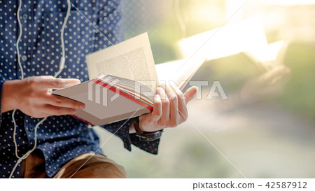 Reflection of male body reading book 42587912