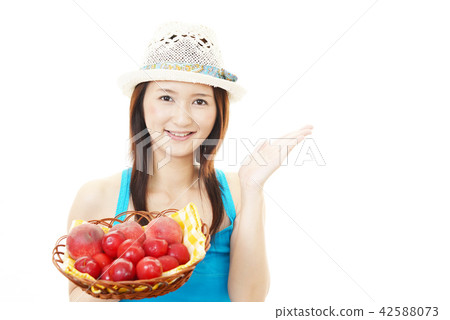 A woman with fruit A woman with fruit 42588073