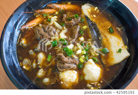 noodles soup with beef and seafood 42595191