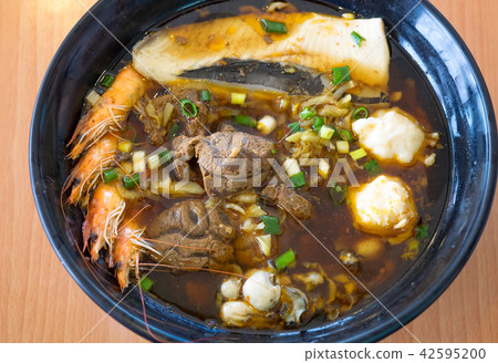 noodles soup with beef and seafood 42595200