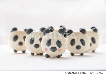 Delicious almond desserts in the form of Panda. French macaron cookies. Cute sweet little animals 42595767