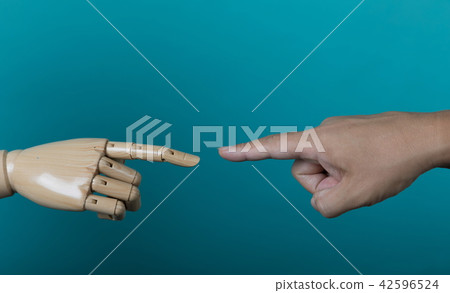 The fingers of a man and the fingers of a mannequin 42596524