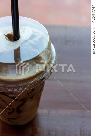 iced blended coffee with milk in plastic glass iced blended coffee with milk in plastic glass 42597744
