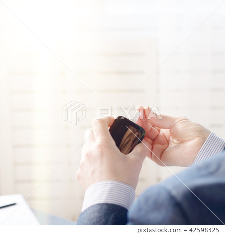 Mid age Man doing blood test  42598325