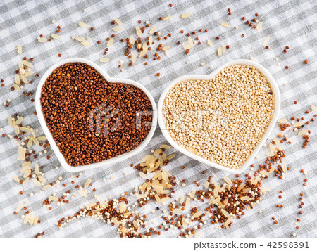 Gluten free grain quinoa in bowls on kitchen table Gluten free grain quinoa in bowls on kitchen table 42598391