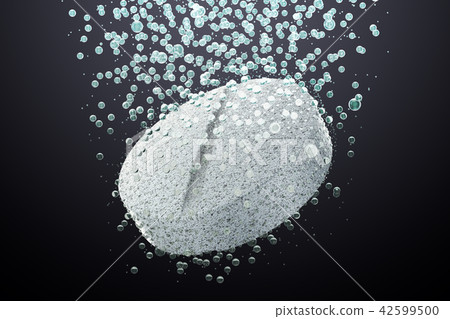 Effervescent soluble tablet pill in water on dark 42599500