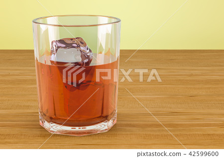Glass with alcohol drink and ice on the table 42599600