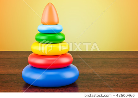 Pyramid toy on the wooden table. 3D rendering Pyramid toy on the wooden table. 3D rendering 42600466