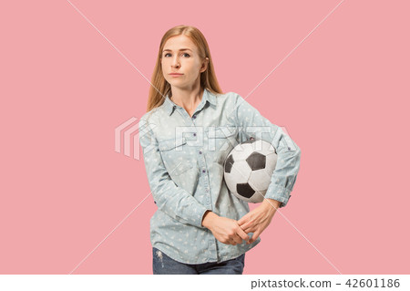 Fan sport woman player holding soccer ball isolated on pink background 42601186