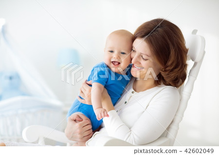 Happy young mother with baby boy at home Happy young mother with baby boy at home 42602049