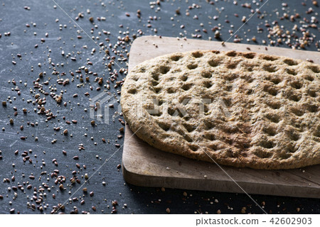 kale flatbread on a table 42602903