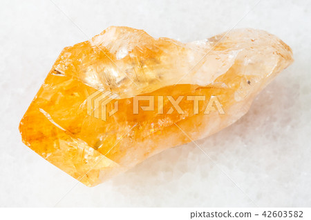 crystal of Citrine (yellow quartz) on white 42603582