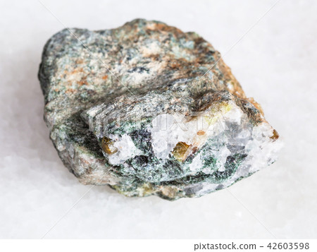Chrysoberyl crystals in raw beryl rock on white Chrysoberyl crystals in raw beryl rock on white 42603598