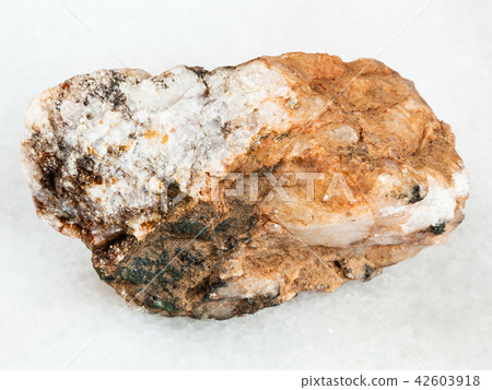 rough Albite stone on white marble 42603918