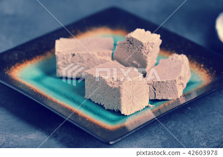 halva chopped into slices on a plate halva chopped into slices on a plate 42603978