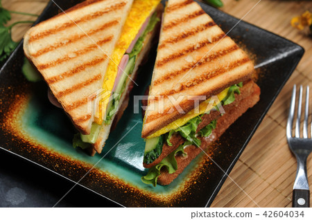triangular shaped sandwiches with ham  42604034