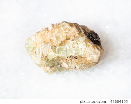 rough chrysoberyl (green beryl) crystal on white 42604105