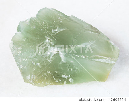 rough Prase (green quartz) stone on white rough Prase (green quartz) stone on white 42604324