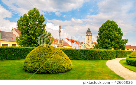 Town park greenery and church of Saint Lawrence in Dacice, Czech Republic 42605026