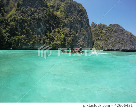 Small wooden long tail boat. Small wooden long tail boat. 42606481