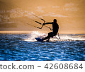 professional kiter makes the difficult trick on a beautiful back 42608684
