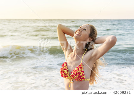 Portrait of beautiful woman by the sea 42609281