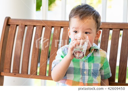 Mixed Race Chinese Caucasian Boy & Glass Of Water 42609450
