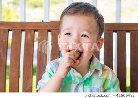 Mixed Race Chinese Caucasian Boy Eating Ice Cream 42609452