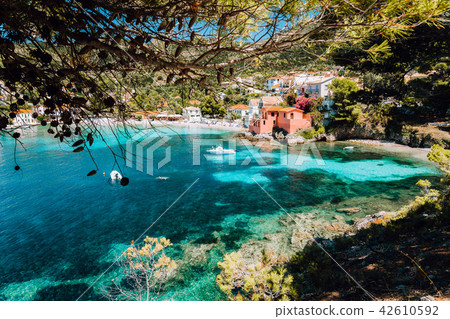 Lovely bay of assos village, Kefalonia, Greece. View on tourquise transparent water framed between 42610592