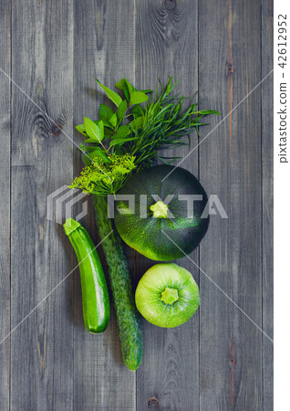 Various green vegetables and greens 42612952